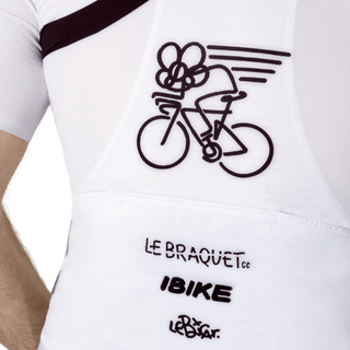 close up of a men wearing a black and white cycling jersey