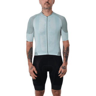 men wearing a mint green cycling jersey