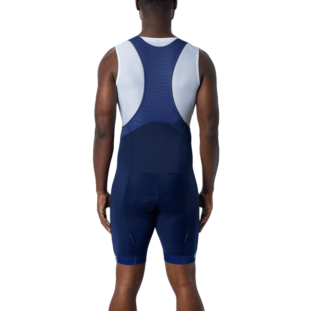 men form the back wearing a blue navy cycling short